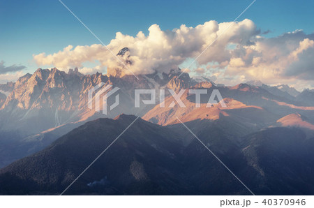 Autumn landscape and snow-capped mountain peaks. View of the mou Autumn landscape and snow-capped mountain peaks. View of the mou 40370946