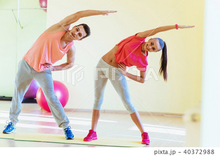two young people in the gym doing exercises for fitness 40372988