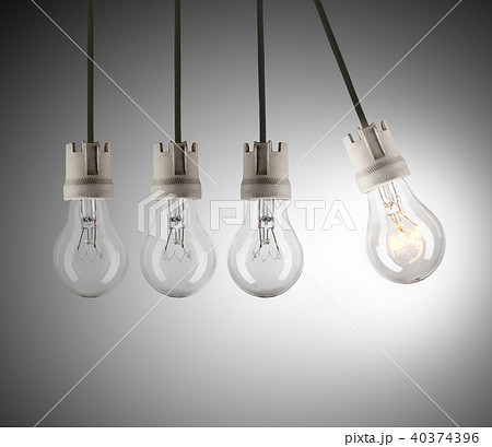 Light bulbs in row with single one shinning Light bulbs in row with single one shinning 40374396