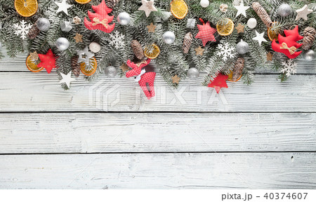 Christmas fir tree with decoration on a wooden board Christmas fir tree with decoration on a wooden board 40374607