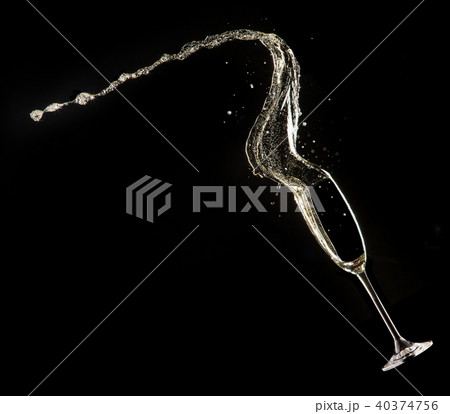 Glass of champagne on black background 40374756