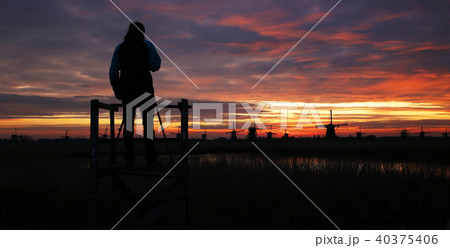 Silhouette of photographer with windmills 40375406