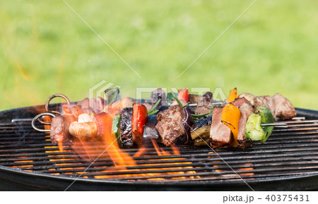 Vegetable and meat skewer on grill Vegetable and meat skewer on grill 40375431