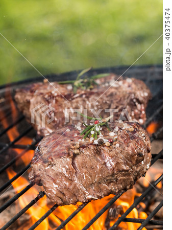 Beef steaks on grill 40375474