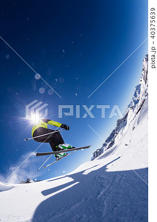 Alpine skier on piste, skiing downhill 40375639