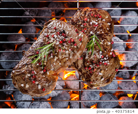 Beef steaks on grill 40375814