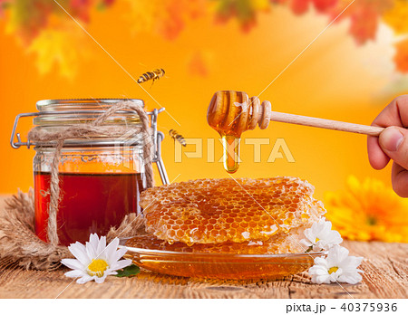 Fresh honey with dipper 40375936