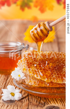Fresh honey with dipper 40375988