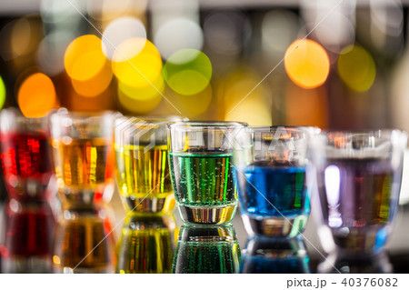 Variation of hard alcoholic shots on bar counter 40376082
