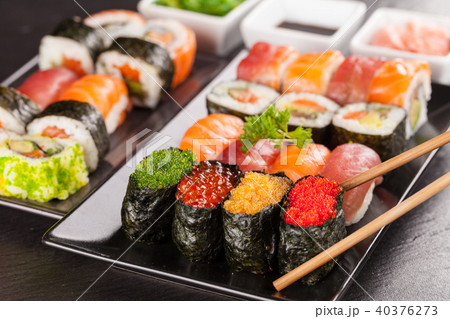 sushi pieces with chopsticks sushi pieces with chopsticks 40376273