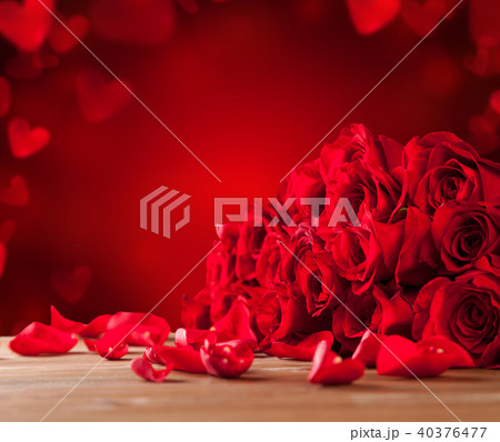 Bouquet of roses on wooden table Bouquet of roses on wooden table 40376477