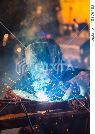 Welder in action. Low depth of focus 40376482