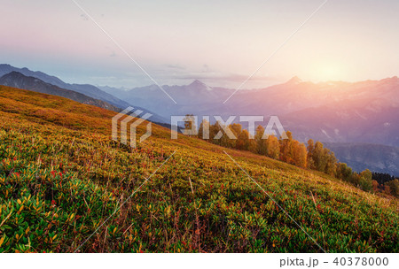 Sunset over snow-capped mountain peaks. 40378000