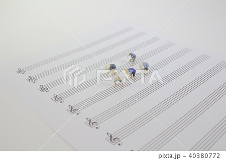 a tiny farmer working on the music sheet a tiny farmer working on the music sheet 40380772