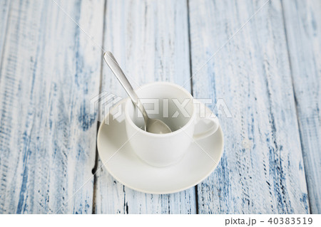 white coffe cup on light wooden background 40383519