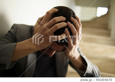 desperate man with his hands in his head desperate man with his hands in his head 40384870