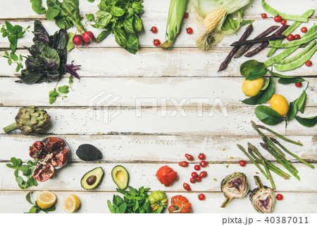 Healthy raw summer vegan ingredients over white wooden background 40387011