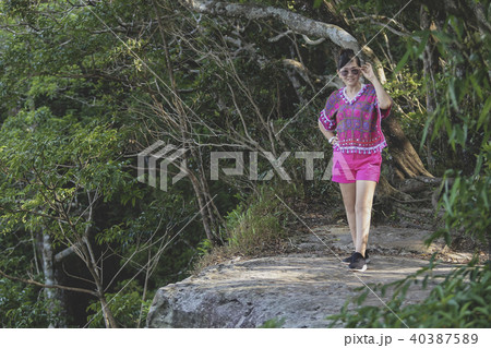 woman  standing in rock cliff 40387589