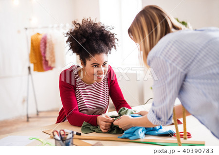 Young creative women in a studio, startup business. 40390783