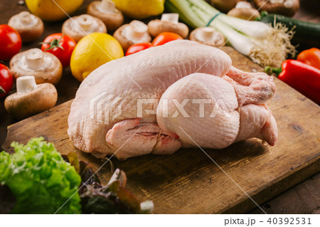 Fresh poultry chicken on wooden table Fresh poultry chicken on wooden table 40392531