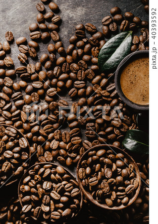 Cup of brewed coffee among aromatic beans Cup of brewed coffee among aromatic beans 40393592