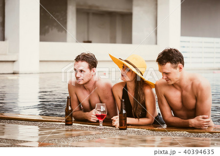 Young people having fun in swimming pool. 40394635