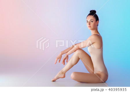 slim gymnast in beige swimsuit 40395935