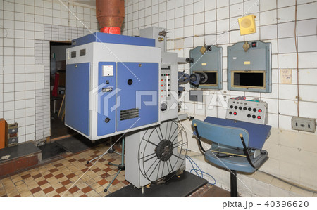 Big old film projector in projection room Big old film projector in projection room 40396620