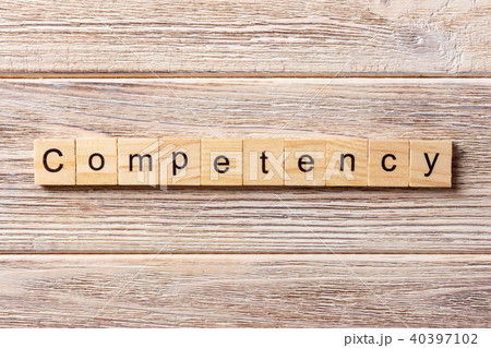 Competency word written on wood block. 40397102