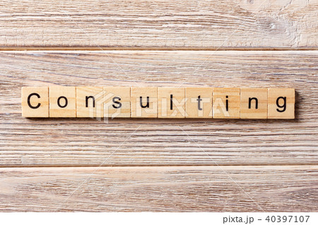 Consulting word written on wood block. 40397107