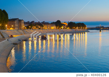 People walking embankment Arles, France 40400126