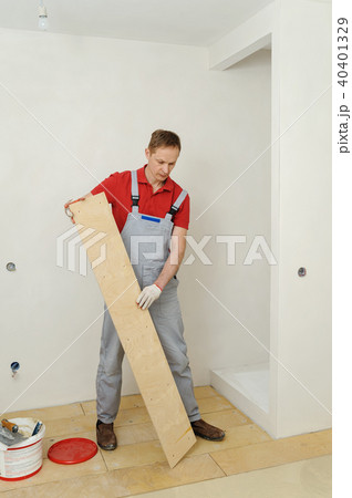 Laying plywood on the floor. Laying plywood on the floor. 40401329
