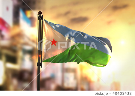 Djibouti Flag Against City Blurred Background Djibouti Flag Against City Blurred Background 40405438