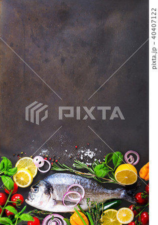 Fresh uncooked fish, dorado, sea bream with lemon Fresh uncooked fish, dorado, sea bream with lemon 40407122