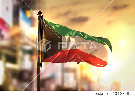 Kuwait Flag Against City Blurred Background 40407586