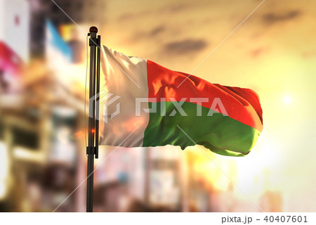 Madagascar Flag Against City Blurred Background 40407601