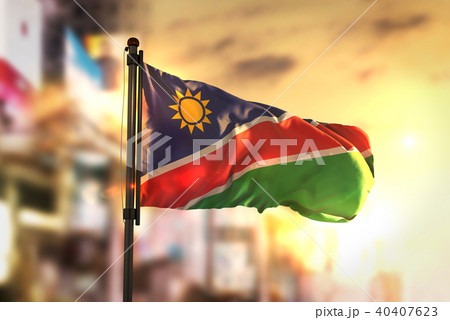 Namibia Flag Against City Blurred Background 40407623