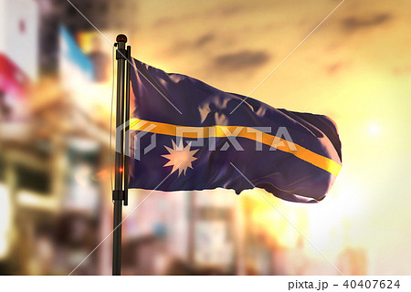 Nauru Flag Against City Blurred Background 40407624