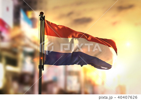 Netherlands Flag Against City Blurred Background 40407626