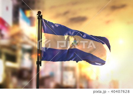 Nicaragua Flag Against City Blurred Background 40407628