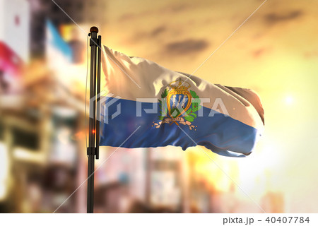 San Marino Flag Against City Blurred Background 40407784