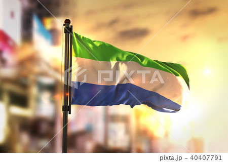 Sierra Leone Flag Against City Blurred Background 40407791