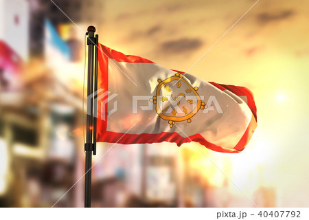 Sikkim Flag Against City Blurred Background 40407792