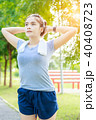 Young woman stretching her arm before exercise 40408723