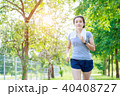 Young woman running at the park 40408727