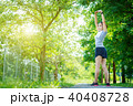 Young woman stretching her arm before exercise 40408728