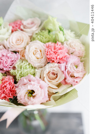 flower arrangement. multicolor bouquet of beautiful flowers on wooden table. Floristry concept 40411446