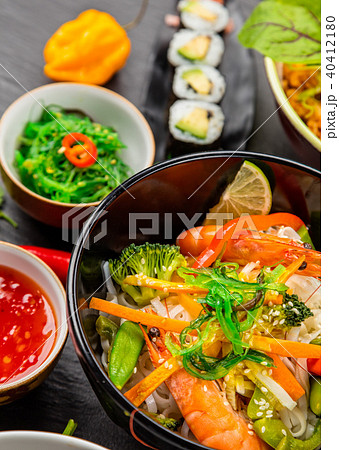 Asian food served on black stone 40412180