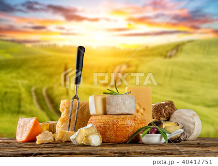 Various types of cheese placed on wooden table Various types of cheese placed on wooden table 40412751