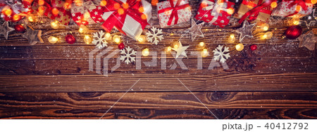 Christmas background with gifts and wooden decorations Christmas background with gifts and wooden decorations 40412792